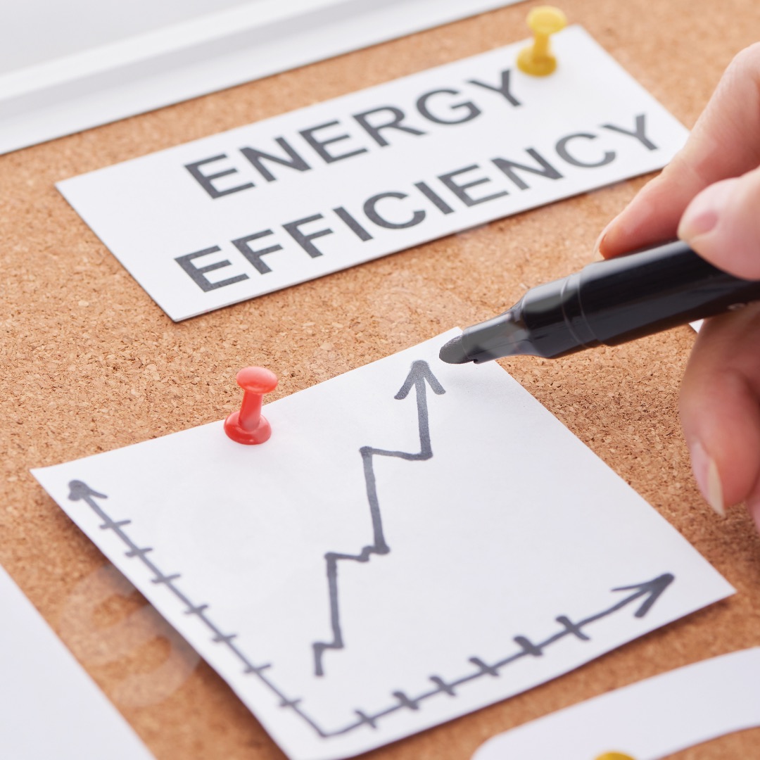 Stack of dollar bills and HVAC tools symbolizing how proper maintenance saves money on energy costs