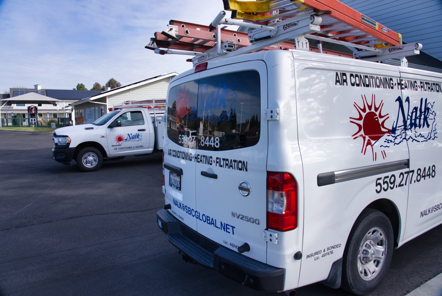 Technician inspecting an aging HVAC system in a Fresno home to determine if replacement is needed